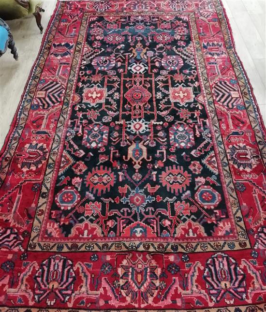 A Hamadan red ground carpet 330 x 200cm